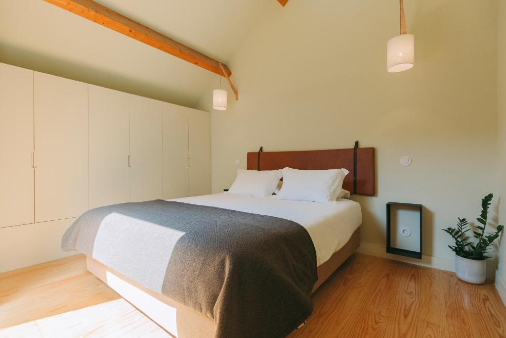 Postel nebo postele na pokoji v ubytování Aparthotel Oporto Palace