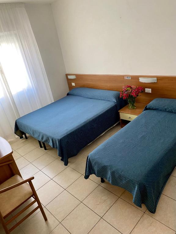 Postel nebo postele na pokoji v ubytování Hotel Ivana