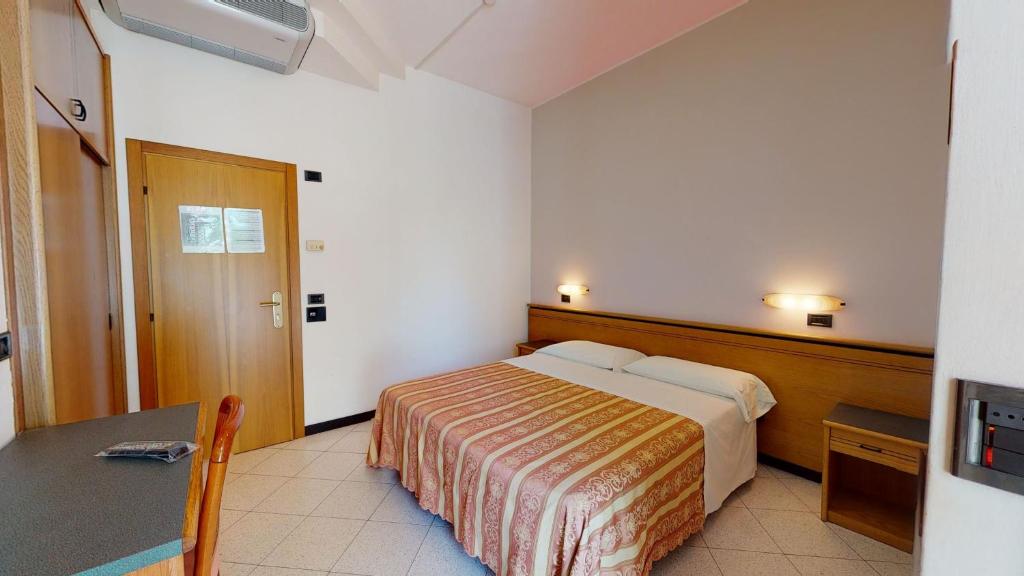 Posteľ alebo postele v izbe v ubytovaní Hotel Excelsior