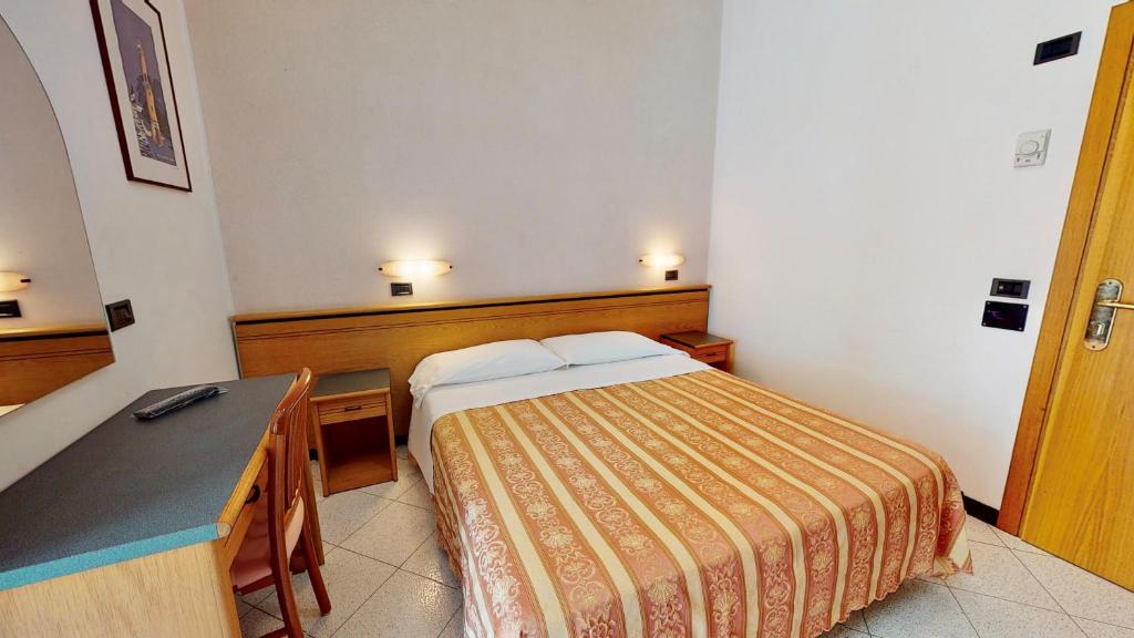 Posteľ alebo postele v izbe v ubytovaní Hotel Excelsior