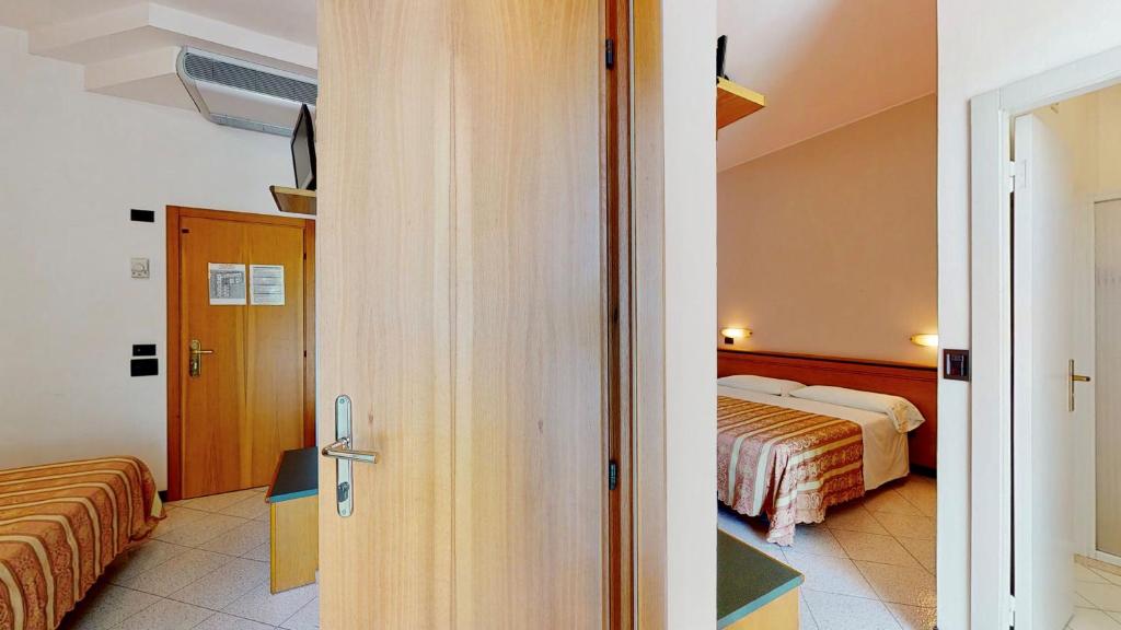 Posteľ alebo postele v izbe v ubytovaní Hotel Excelsior