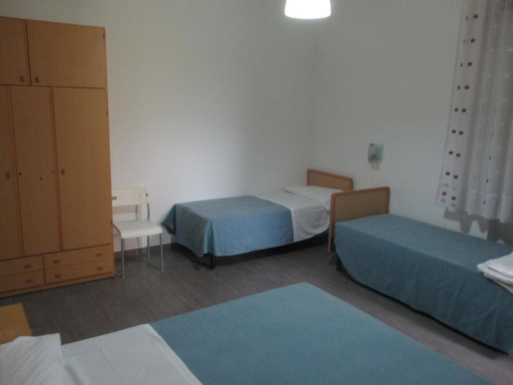 Postel nebo postele na pokoji v ubytování Hotel Abamar