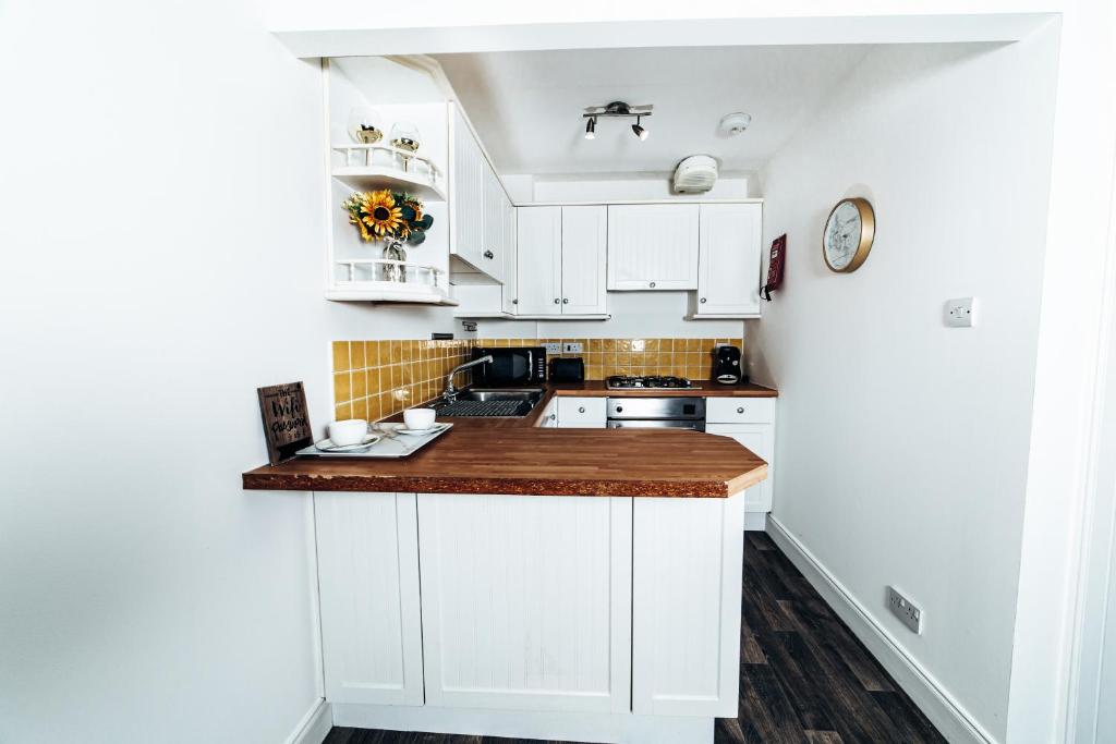 Kuchyň nebo kuchyňský kout v ubytování Princes Street Apartment