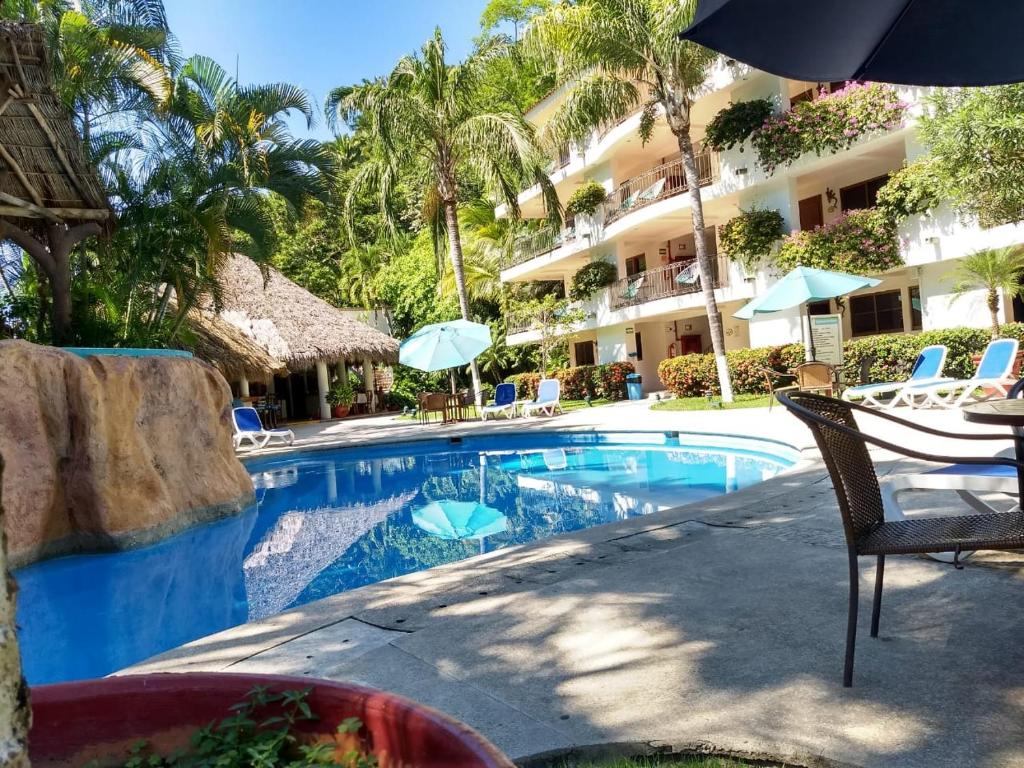 Bazén v ubytování Hotel Casa Iguana Mismaloya nebo v jeho okolí