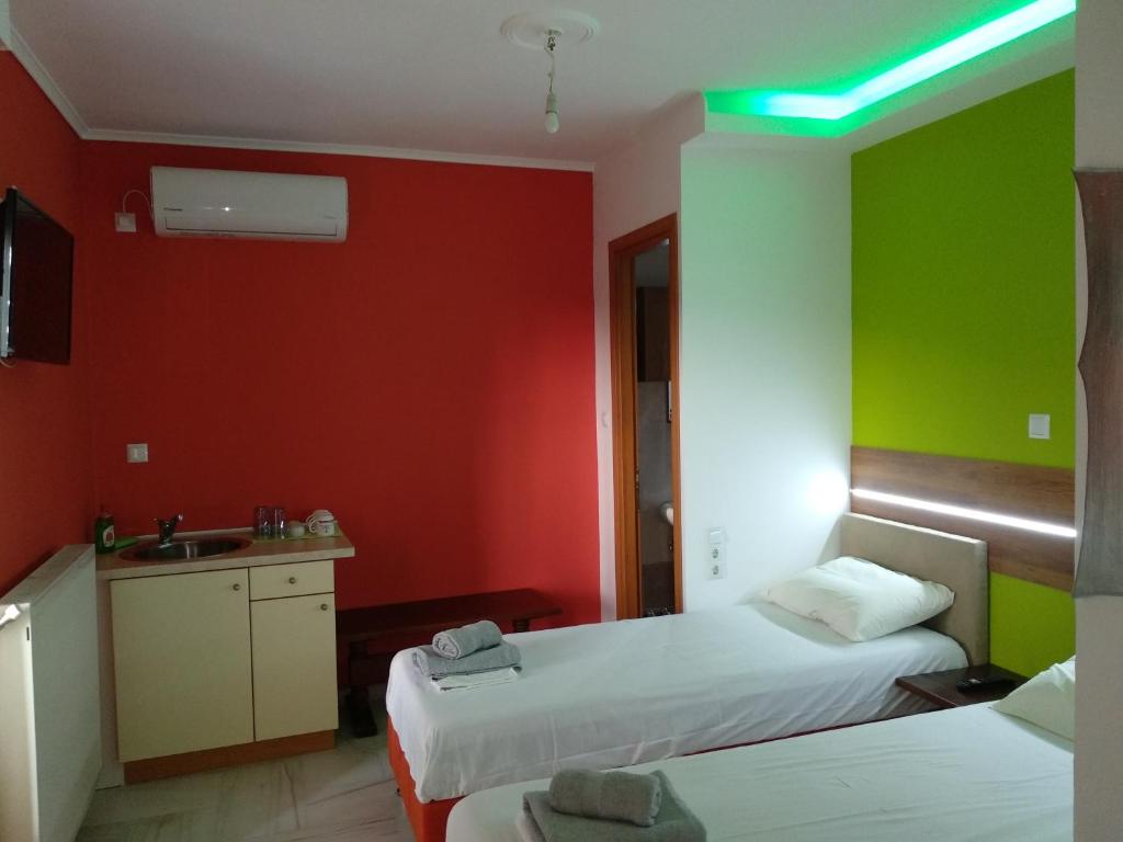 A bed or beds in a room at Villa Agnanti Apts and Suites