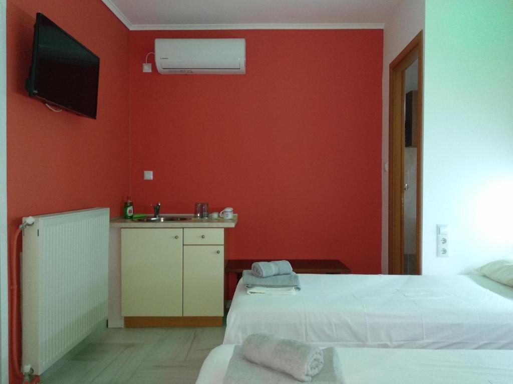 A bed or beds in a room at Villa Agnanti Apts and Suites