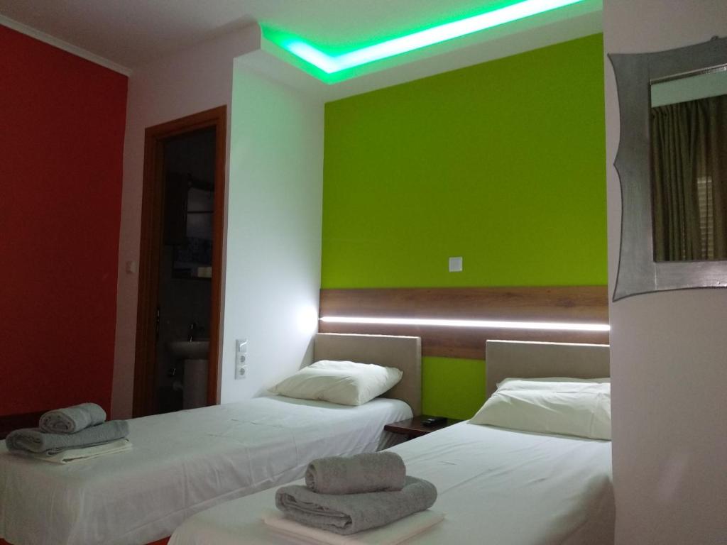 A bed or beds in a room at Villa Agnanti Apts and Suites
