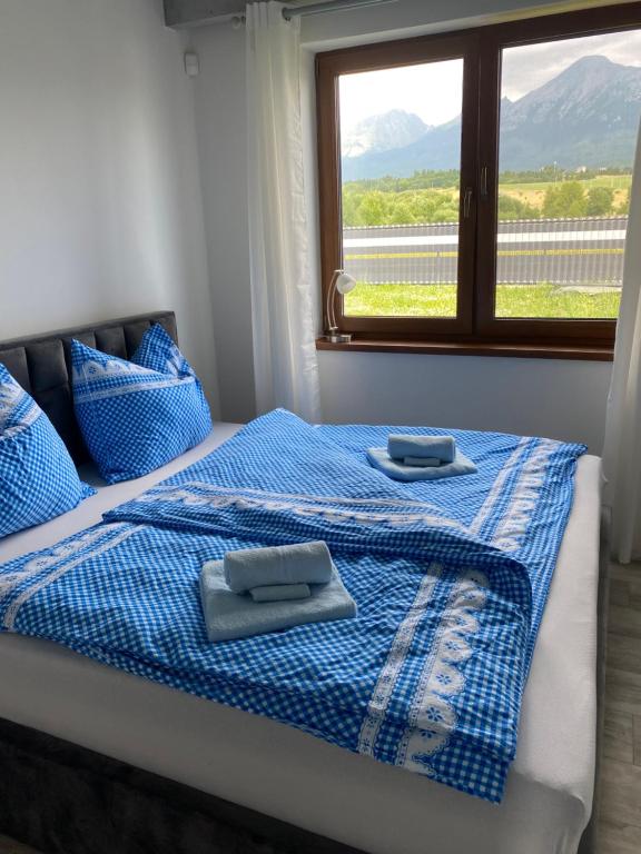 Posteľ alebo postele v izbe v ubytovaní u Boženky
