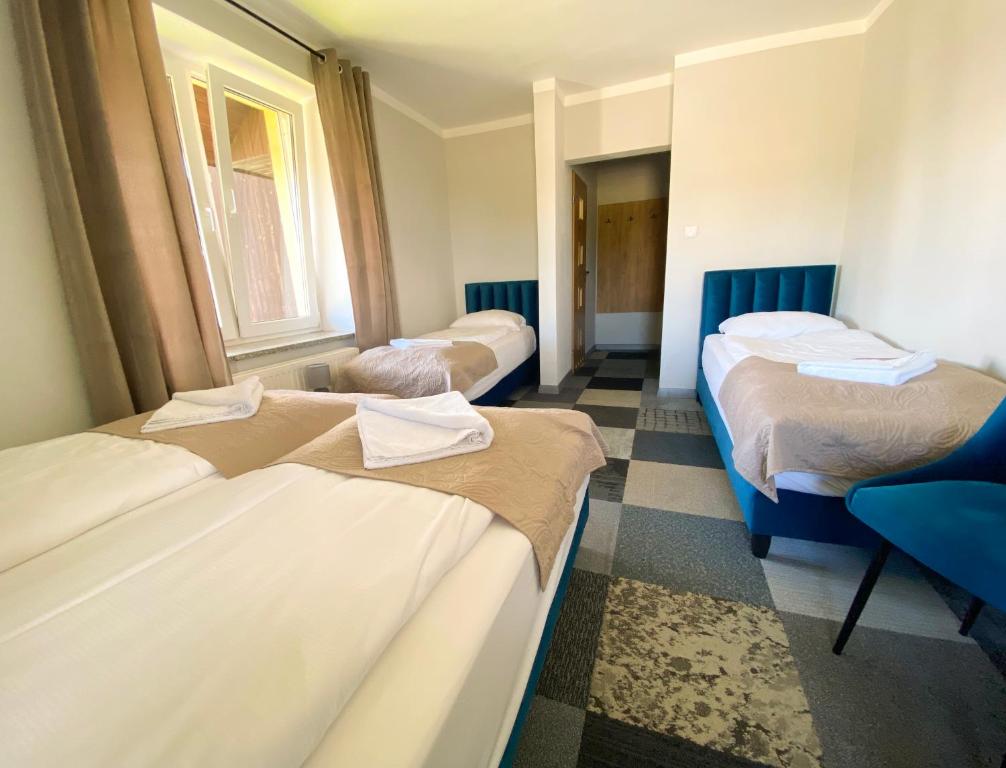 Postel nebo postele na pokoji v ubytování Ośrodek Szkoleniowo Wypoczynkowy GOPR