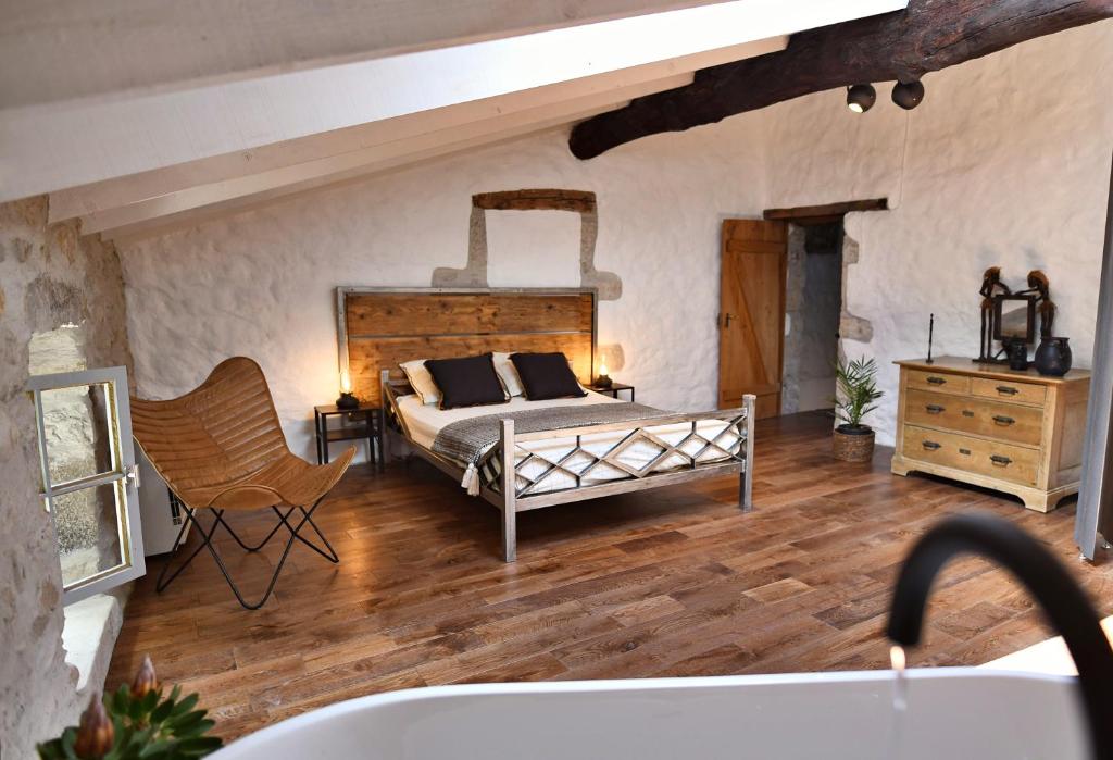 Posezení v ubytování Le Bruit de l'Eau (Chambre Loft)