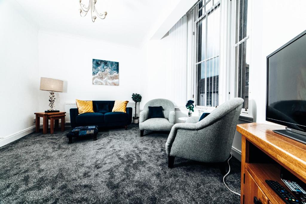 TV a/nebo společenská místnost v ubytování Princes Street Apartment