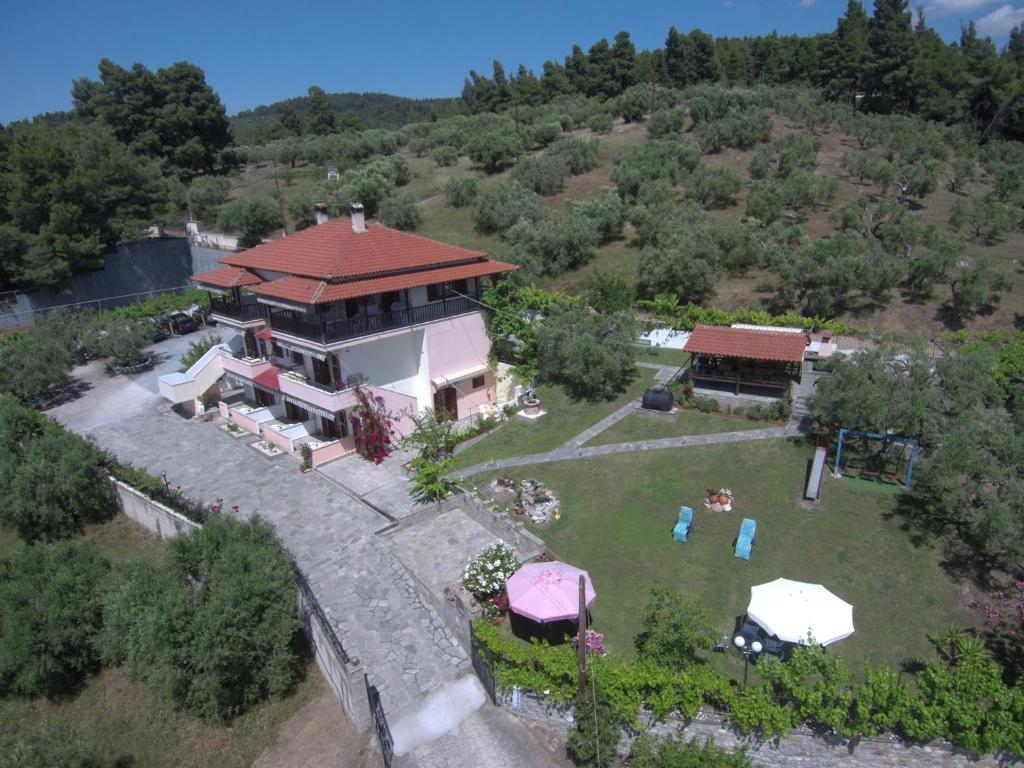 an aerial view of a house with a yard at House Panorama Sea View in Neos Marmaras