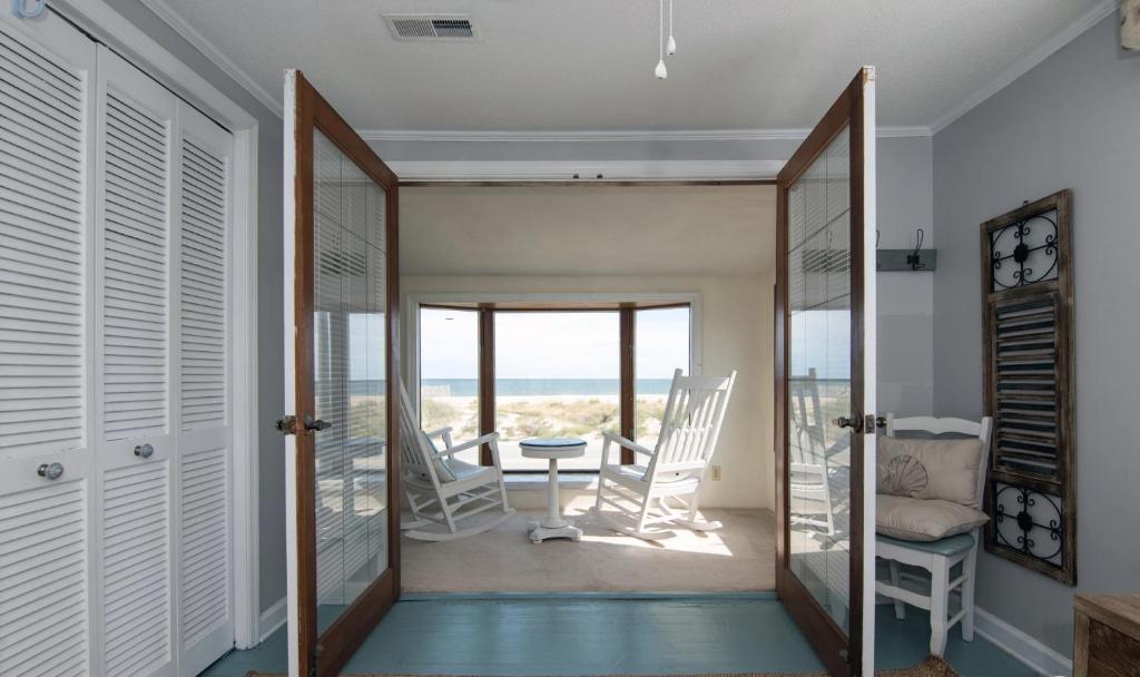 a hallway with a view of the ocean from a house at Moonlighting in Edisto Beach