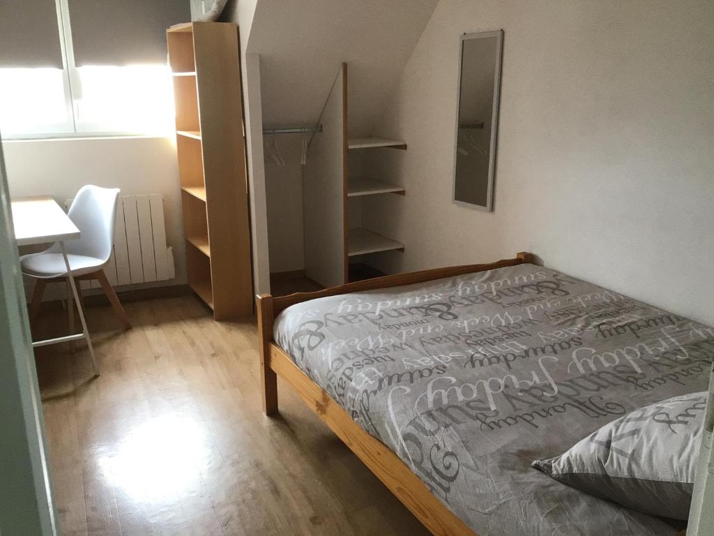 Postel nebo postele na pokoji v ubytování Le Jade d' Arradon