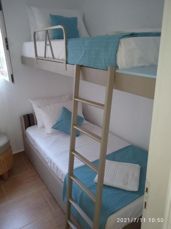 Łóżko lub łóżka w pokoju w obiekcie Seashell apartment