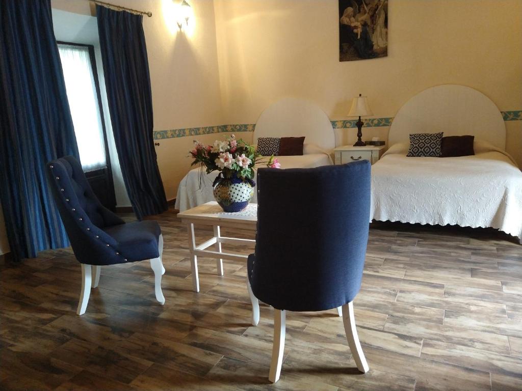 Posezení v ubytování Hotel Spa Hacienda Real la Nogalera