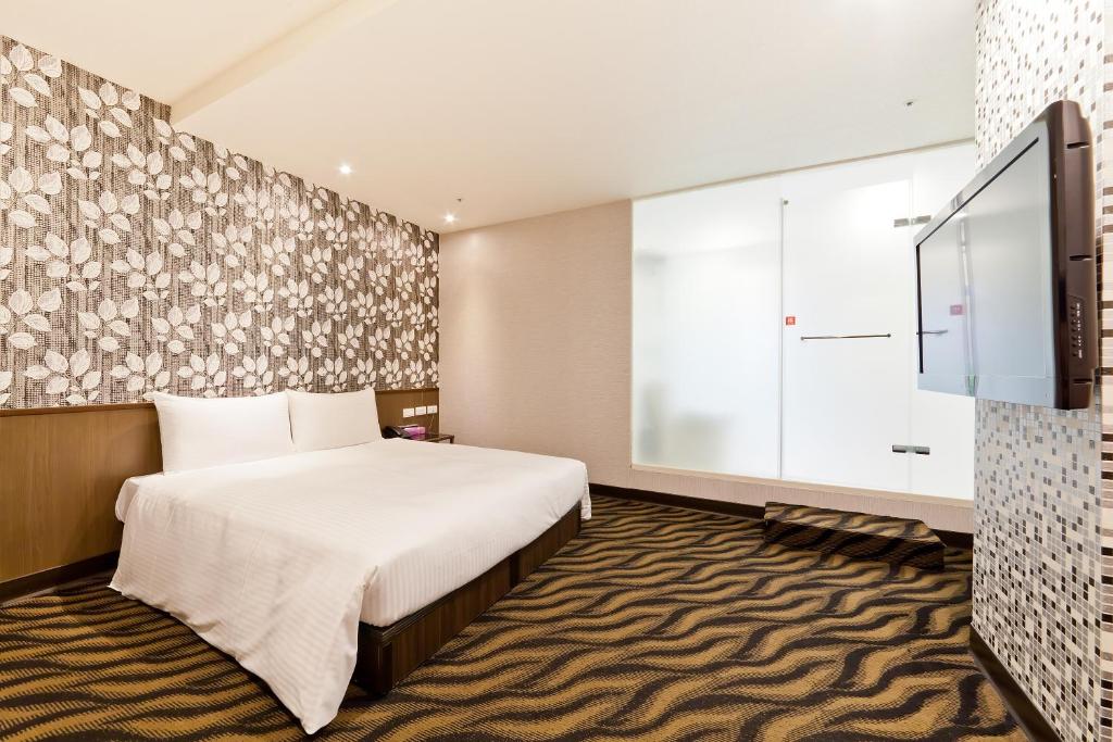 Postel nebo postele na pokoji v ubytování Hotel 6 - ZhongHua