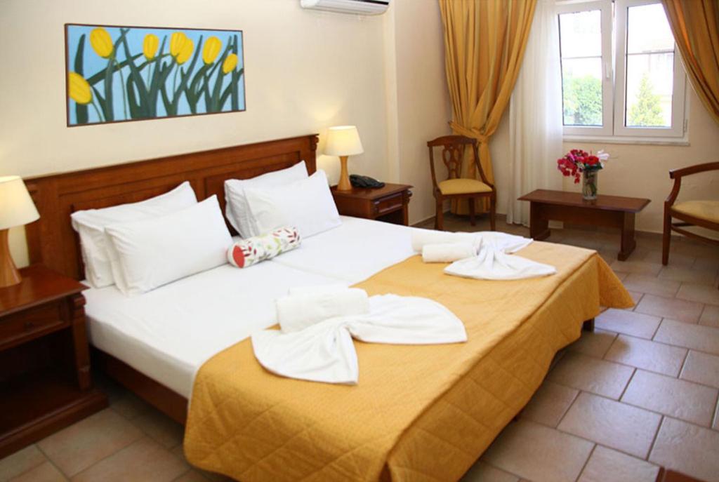 Posteľ alebo postele v izbe v ubytovaní Alexander House Hotel