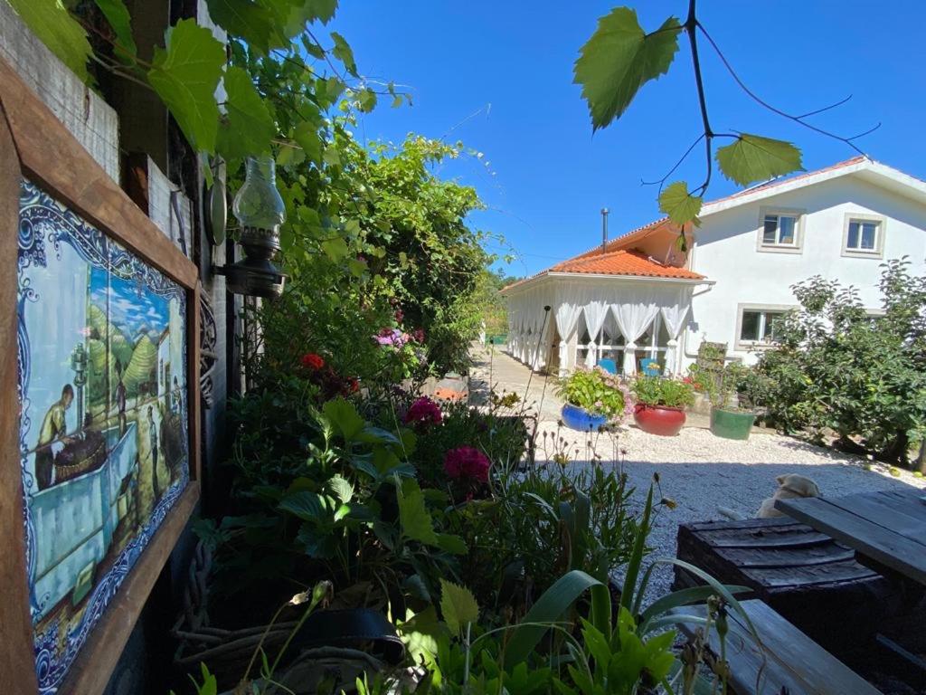 a painting on the side of a building with a bench at Casa Traca in Valbona