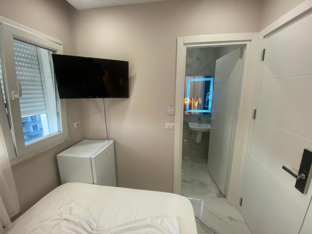 Postel nebo postele na pokoji v ubytování Hotel Margjokaj