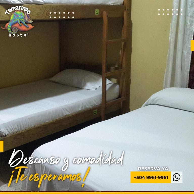 Postel nebo postele na pokoji v ubytování Tamarindo Hostel