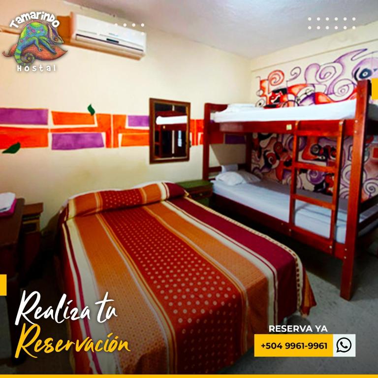 Postel nebo postele na pokoji v ubytování Tamarindo Hostel