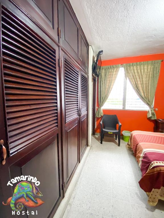 Postel nebo postele na pokoji v ubytování Tamarindo Hostel