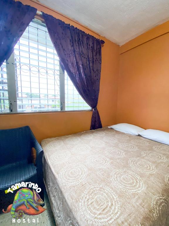 Postel nebo postele na pokoji v ubytování Tamarindo Hostel