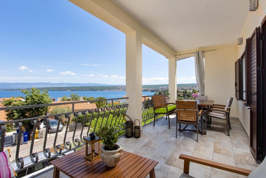 a balcony with a view of the water at AnD Charming new apartment in Vantačići in Malinska
