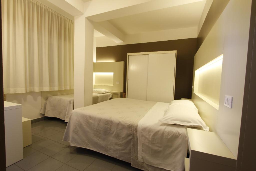 Postel nebo postele na pokoji v ubytování Hotel Desire'