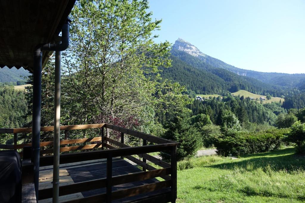 a view from the porch of a house overlooking a valley at Bel Air en Chartreuse in Saint-Pierre-de-Chartreuse