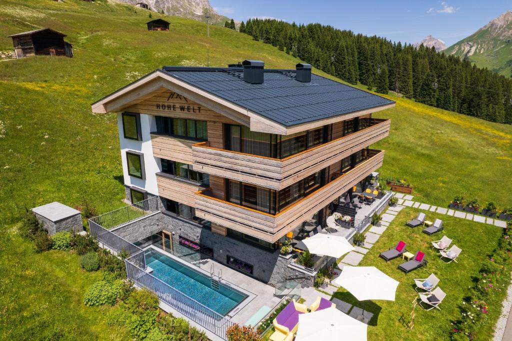 an aerial view of a house with a pool at Chalet Hohe Welt - luxury apartments in Lech am Arlberg