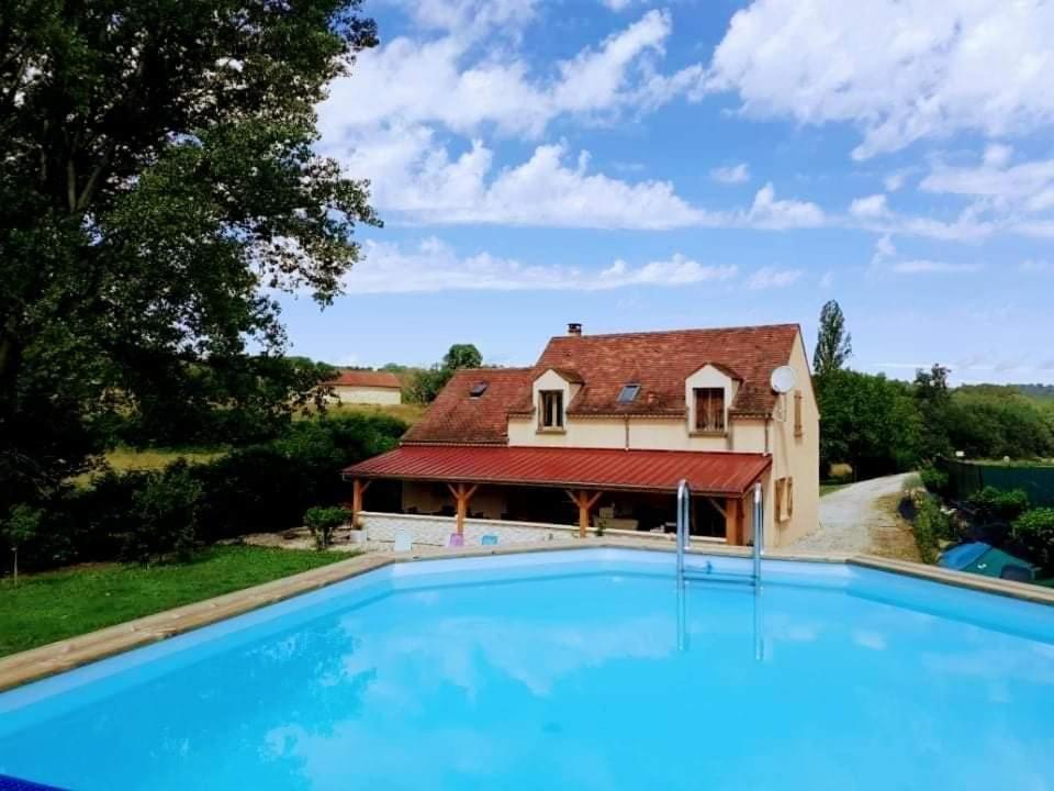 a house with a swimming pool in front of a house at villa tsilaocia nabirat in Nabirat