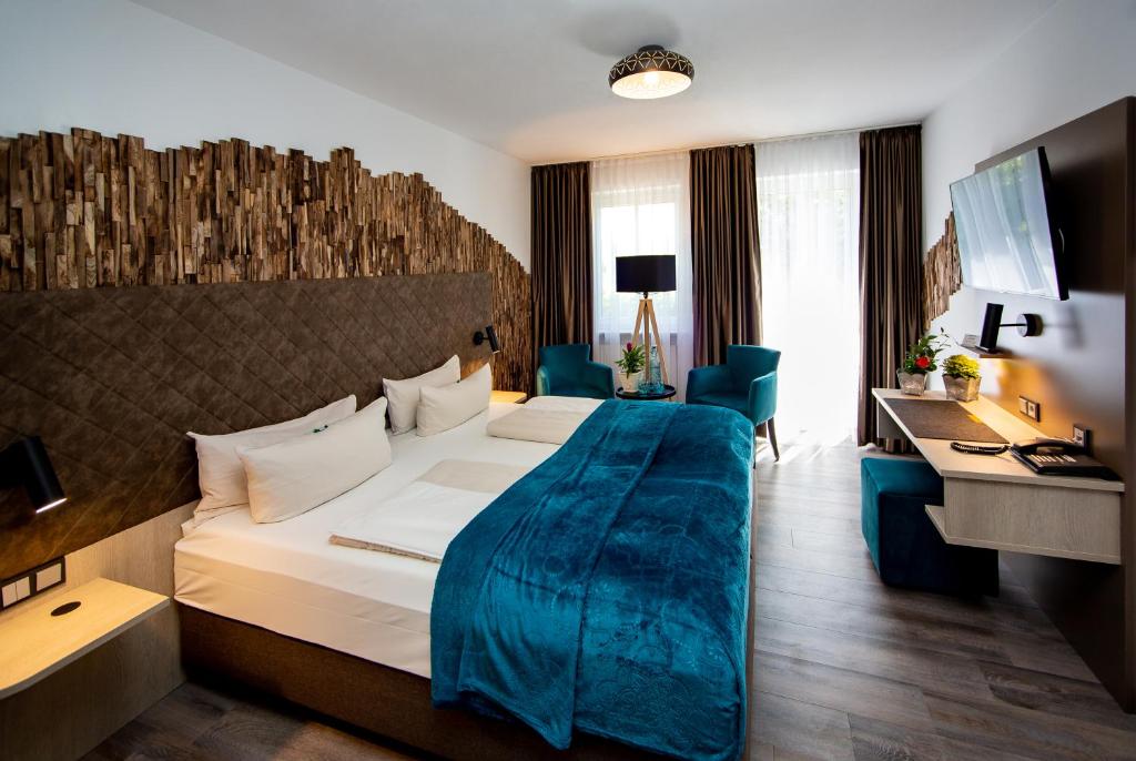 Postel nebo postele na pokoji v ubytování Arcus Hotel München Messe