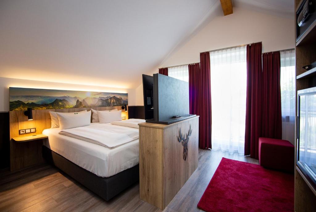 Postel nebo postele na pokoji v ubytování Arcus Hotel München Messe