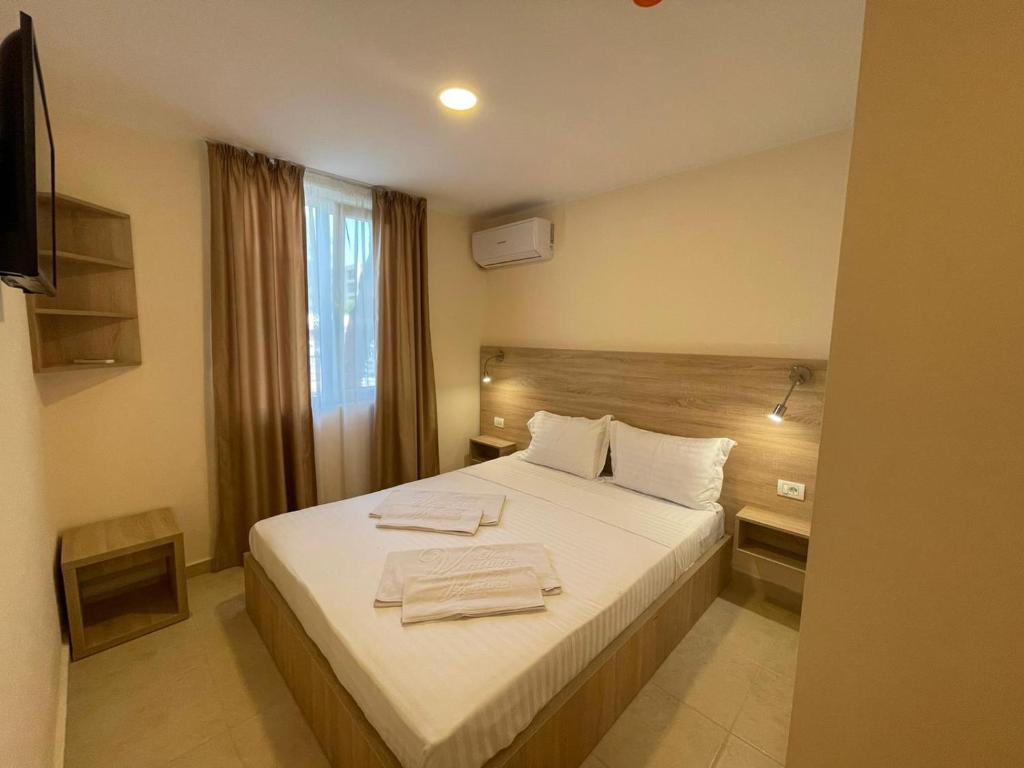 Postel nebo postele na pokoji v ubytování Hotel Olt by Ventura