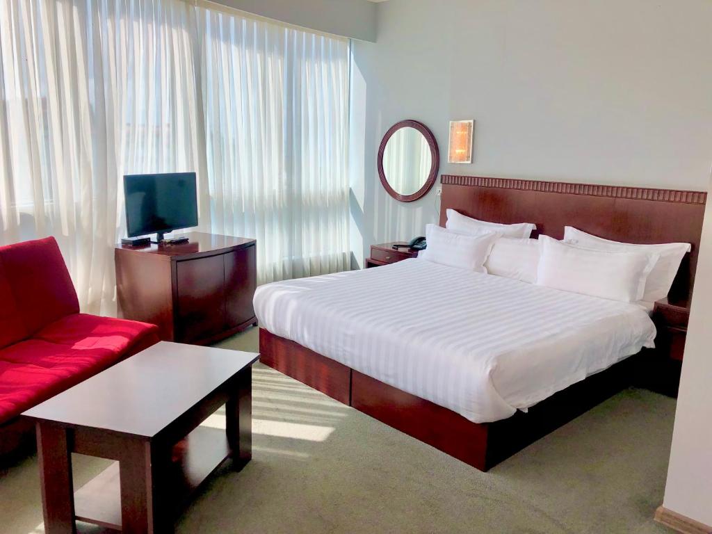 Postel nebo postele na pokoji v ubytování Hotel Aisi