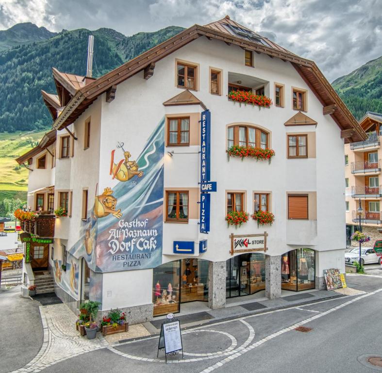 a building in the middle of a street at Gasthof Alt Paznaun in Ischgl