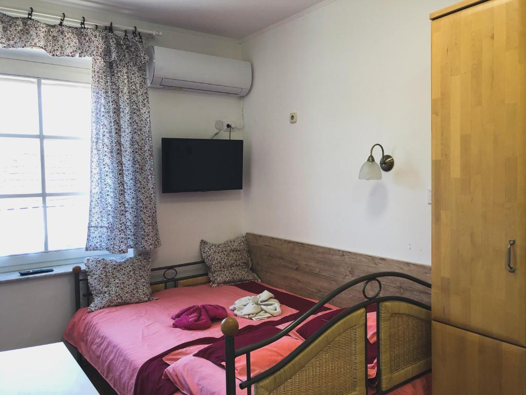 Postel nebo postele na pokoji v ubytování Diána Apartman Bogács