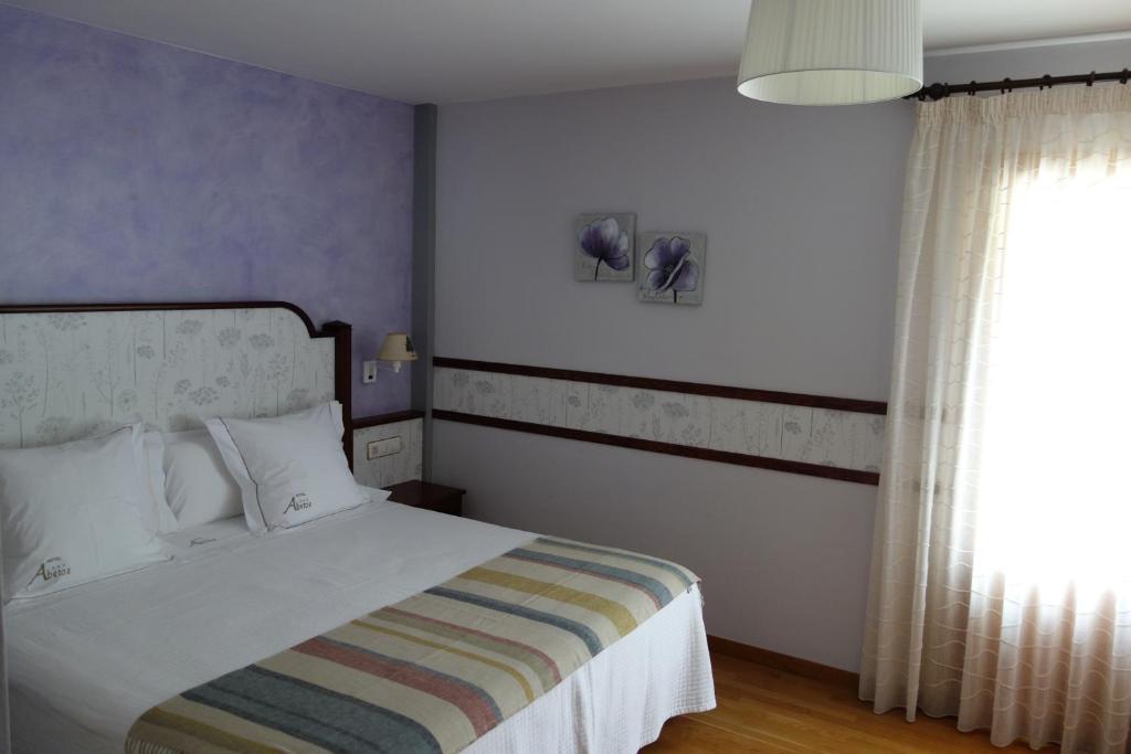 Postel nebo postele na pokoji v ubytování Hotel Abetos