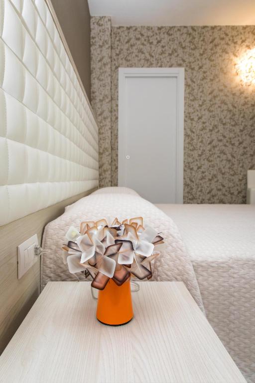 Postel nebo postele na pokoji v ubytování 4essences Boutique Rooms