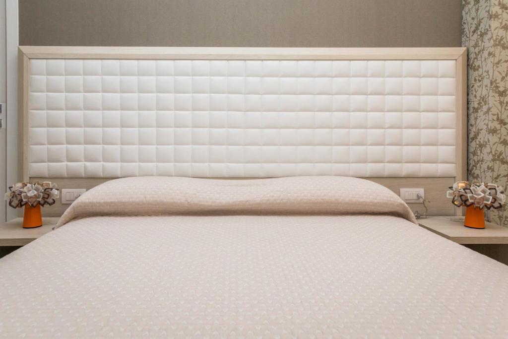 Postel nebo postele na pokoji v ubytování 4essences Boutique Rooms