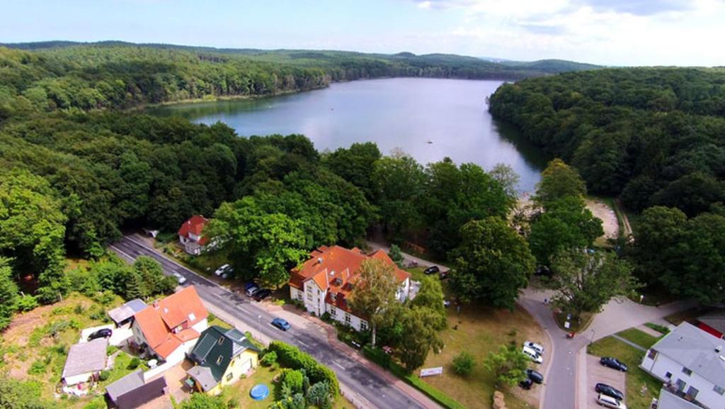 an aerial view of a river and a house at Idyll Am Wolgastsee in Korswandt
