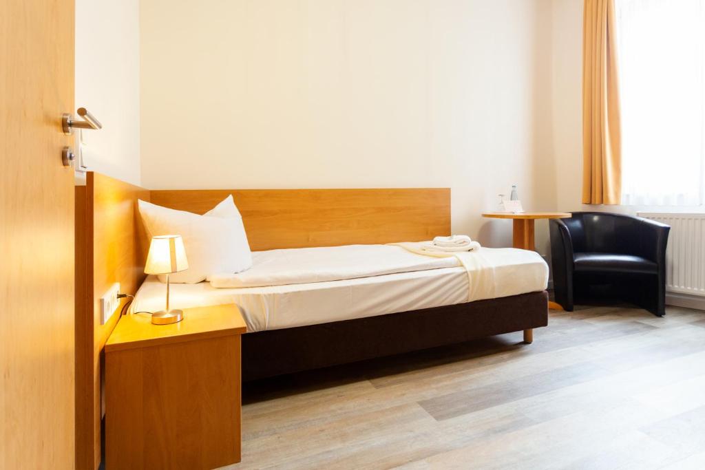 Postel nebo postele na pokoji v ubytování Altora Eisenbahn Themenhotel
