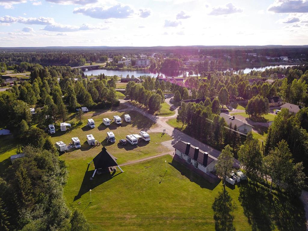 an aerial view of a park with cars parked on a field at Camping Nilimella in Sodankylä