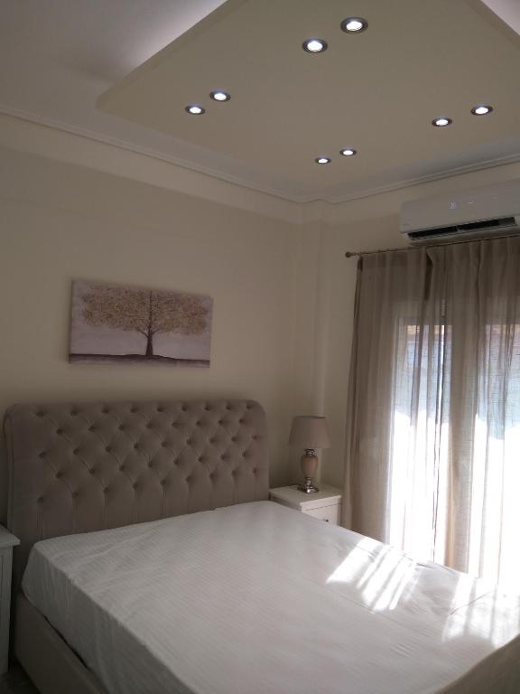 Posteľ alebo postele v izbe v ubytovaní NAFPAKTOS Beach luxury Suites