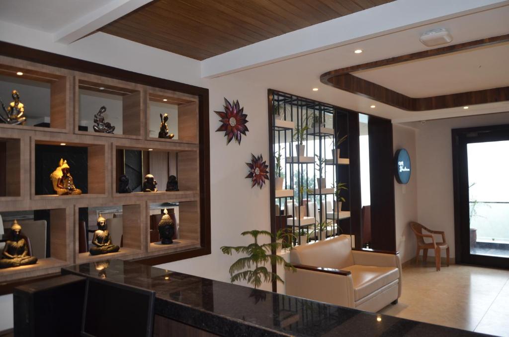 a room with a lobby with a counter and a chair at Best Western Dalhousie in Dalhousie