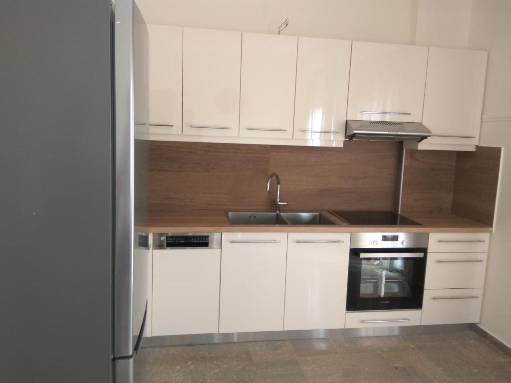 Kuchyňa alebo kuchynka v ubytovaní NAFPAKTOS Beach luxury Suites
