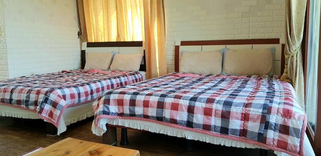 Postel nebo postele na pokoji v ubytování Jun House