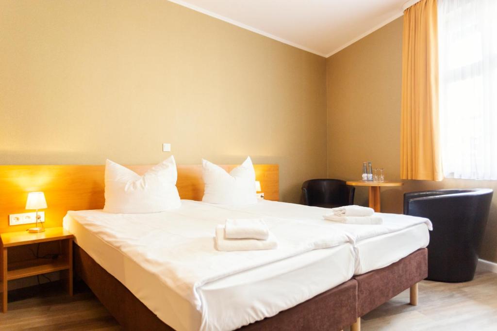 Postel nebo postele na pokoji v ubytování Altora Eisenbahn Themenhotel